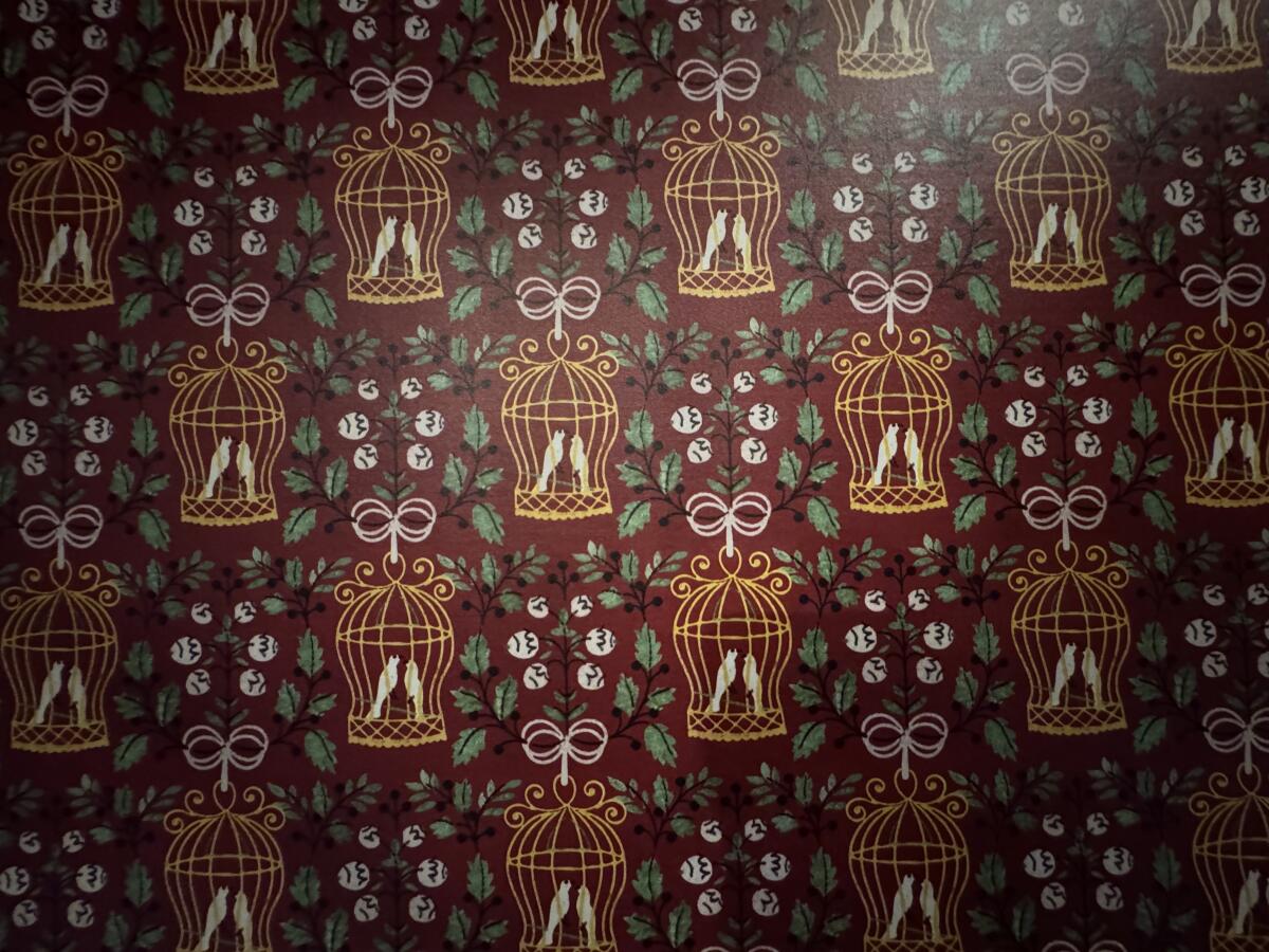 The new Bird Cage Theatre wallpaper recreates the original that was discovered during the renovation.