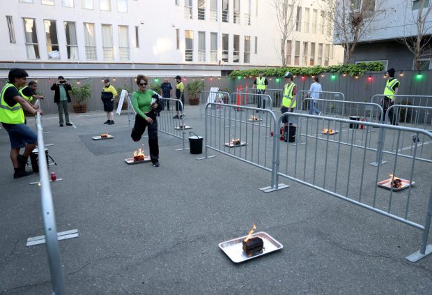 People leap over fire logs during the Persian New Year Festival on Durant Avenue in Berkeley, Calif., on Tuesday, March 17, 2026. (Jane Tyska/Bay Area News Group)