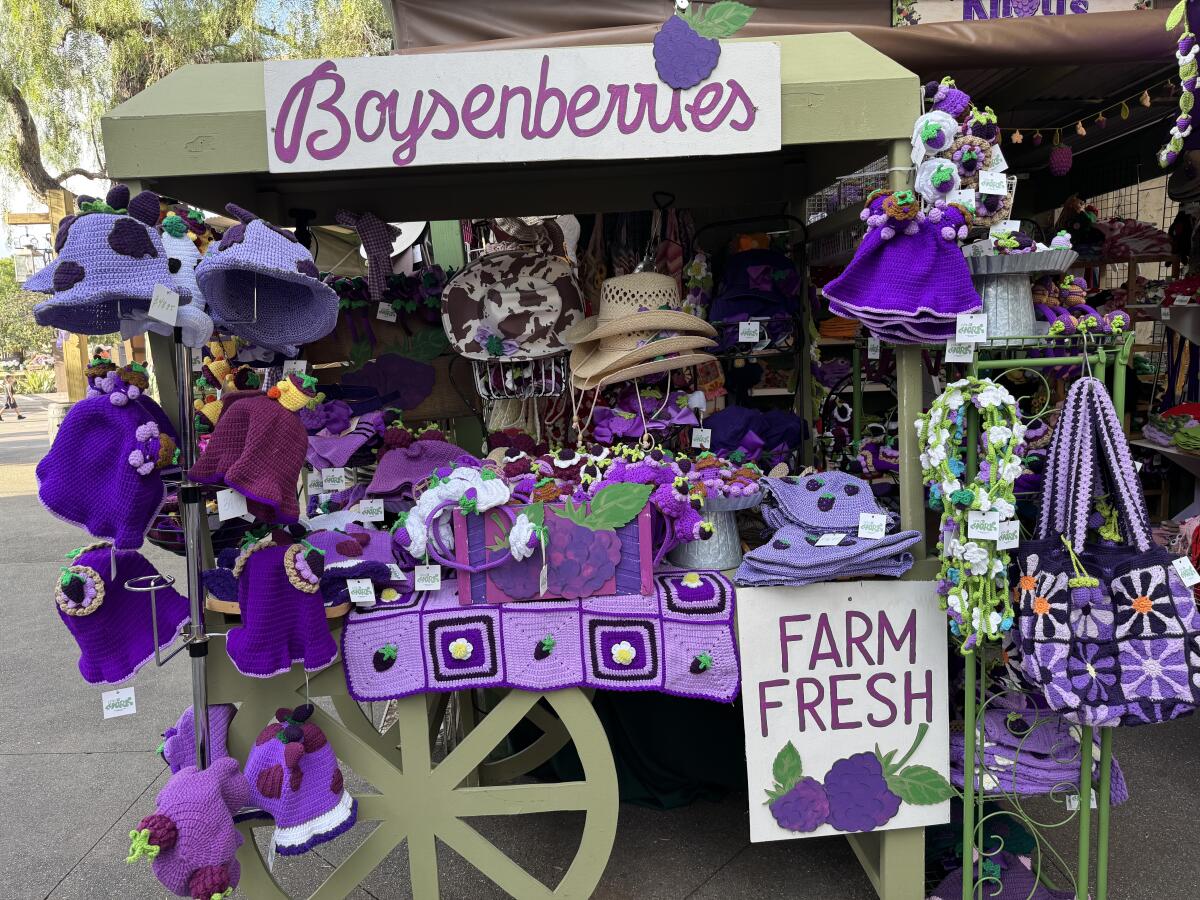 A cart is laden with themed souvenirs at the Boysenberry Festival Crafts Fair in Ghost Town.