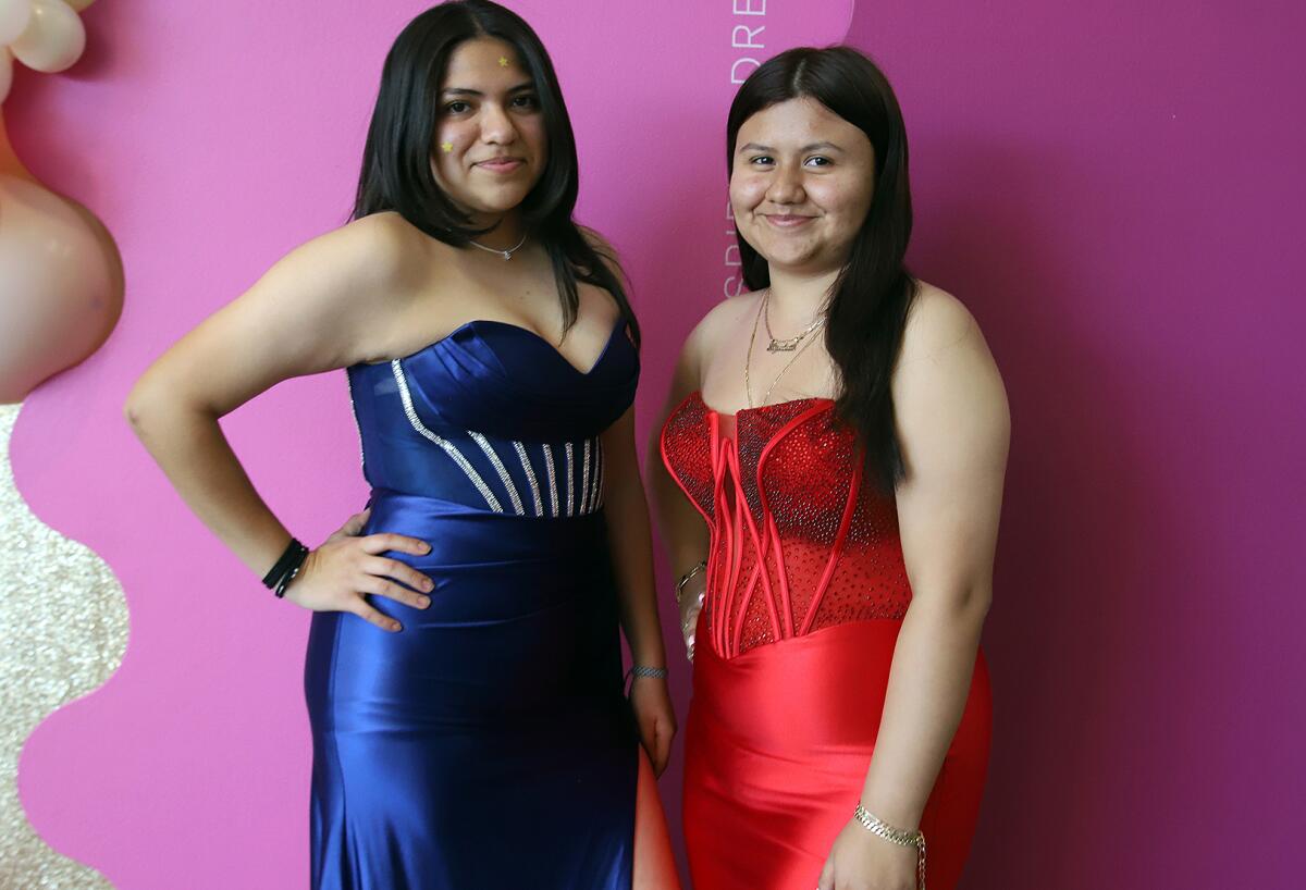Elizabeth Jaime, 18, left, and Karen Lavios, 17, at Cinderella's Closet of Orange County's prom dress event.