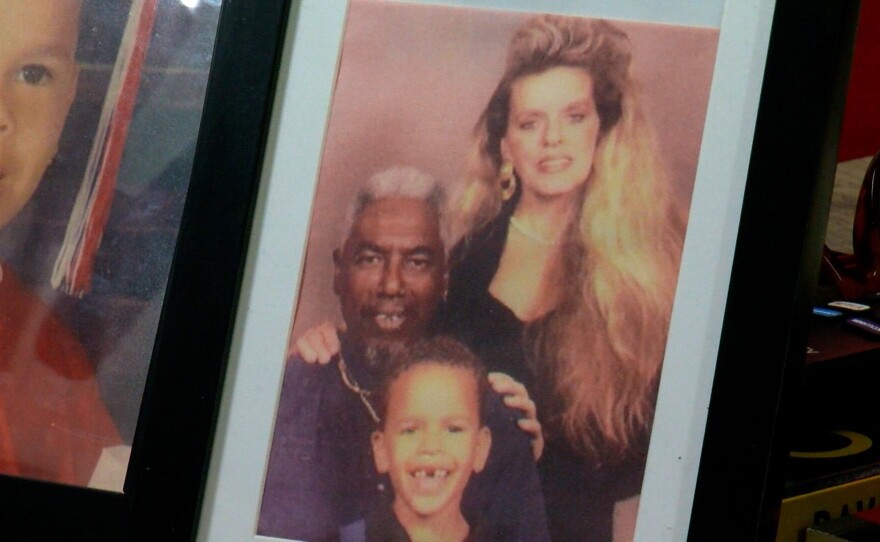 A photo of Shane Harris and his parents, Jose and Kimberly, sits on his desk on Thursday, March 19, 2026.