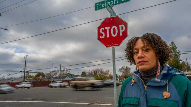 Kiara Reed, executive director of Civic Thread, stands on the corner of Freeport Boulevard at Oregon Drive in Sacramento on Dec. 18, 2024. Sacramento’s plan to redesign Freeport Boulevard for pedestrian and cyclist safety scored 92 out of 100 points in the 2024 Active Transportation Program cycle but did not receive funding after the state slashed hundreds of millions of dollars from the grant program.