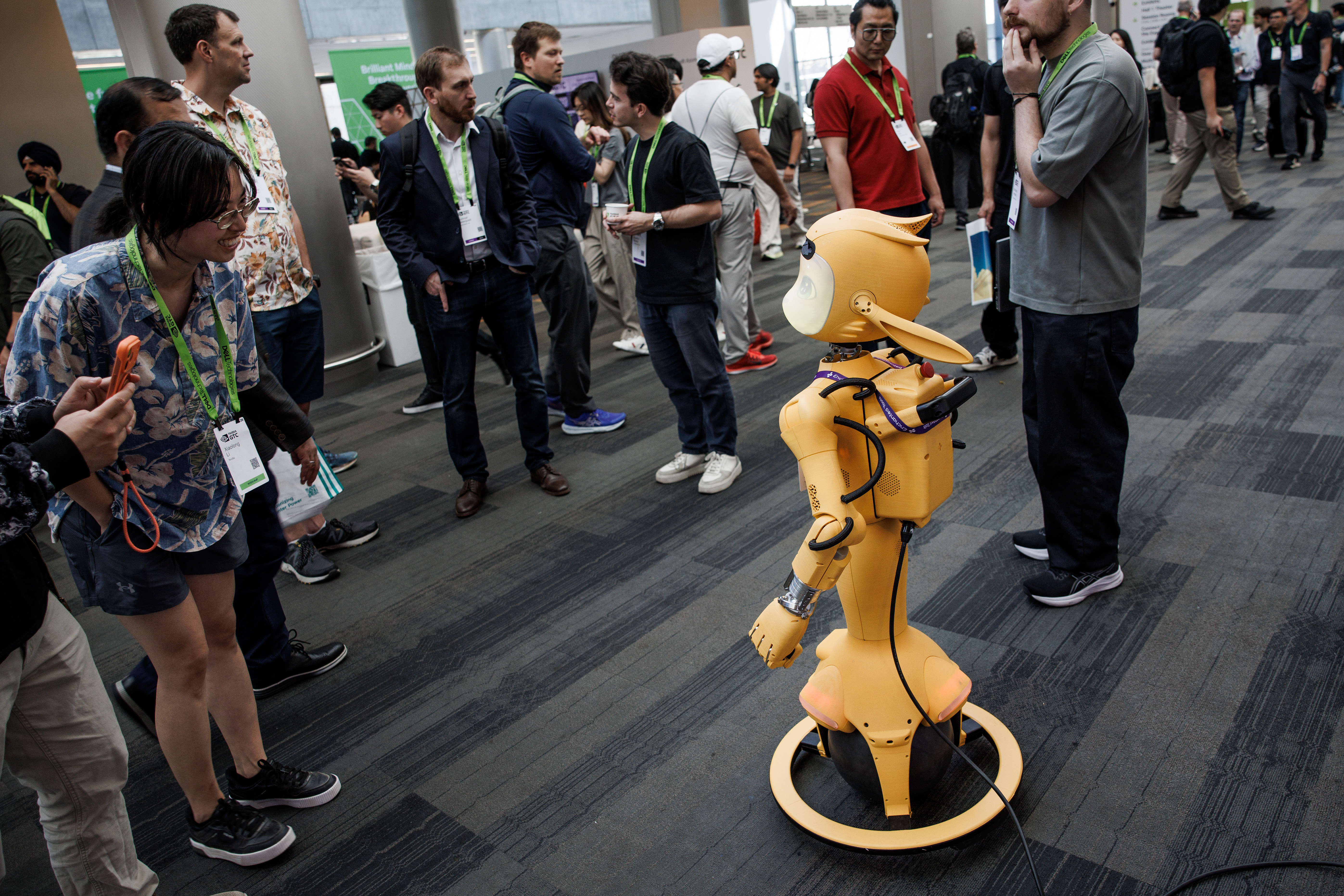 Attendees view âMiroki,â an AI-powered social companion robot, at the...