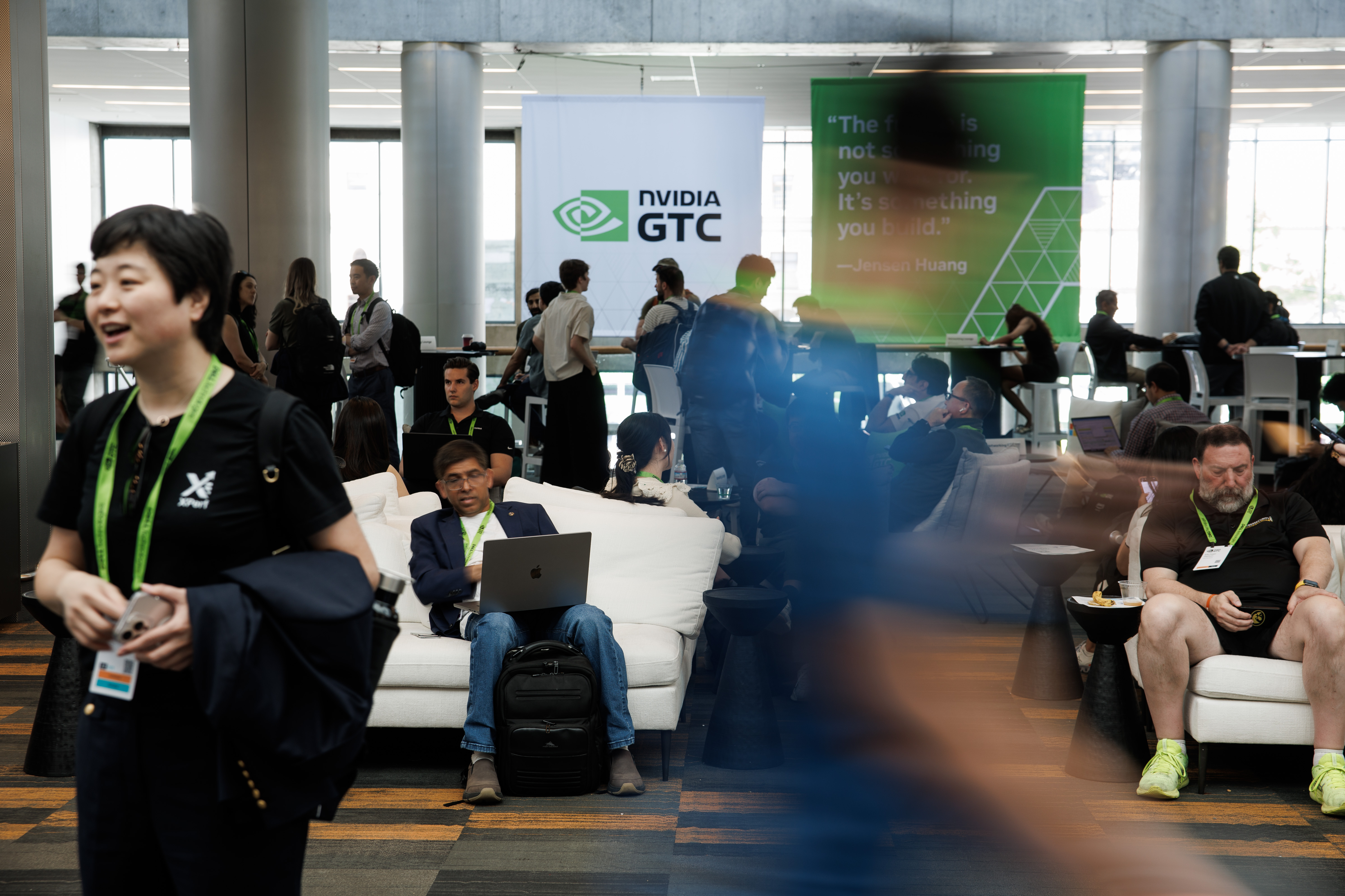 People attend the Nvidia GTC 2026 conference at the San...