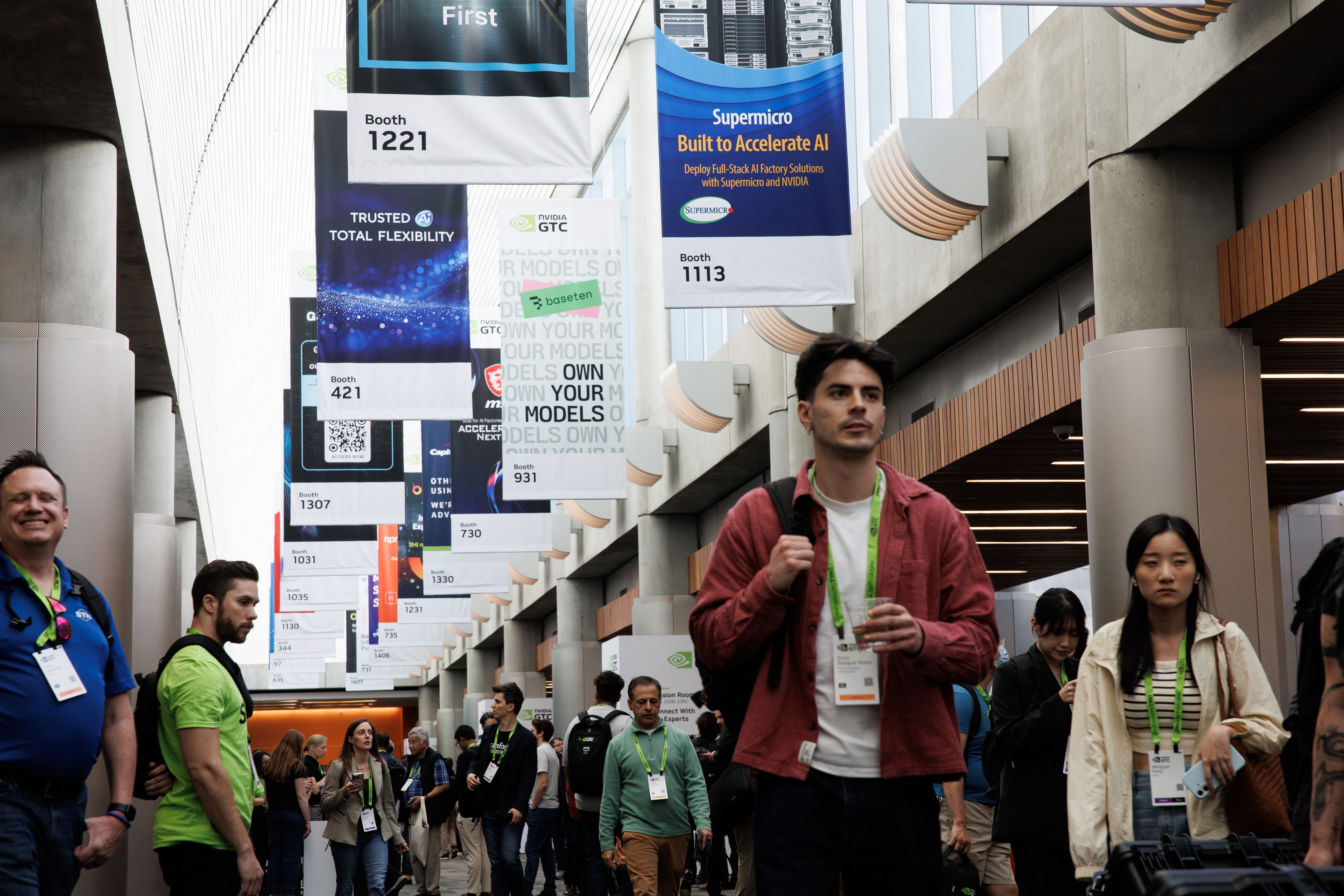 People attend the Nvidia GTC 2026 conference at the San...