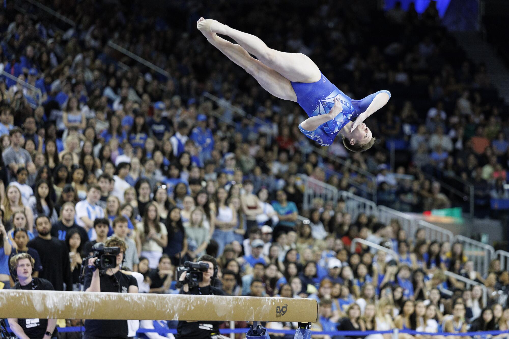 UCLA freshman Nola Matthews gets height on her dismount from the balance beam during a meet against Nebraska.