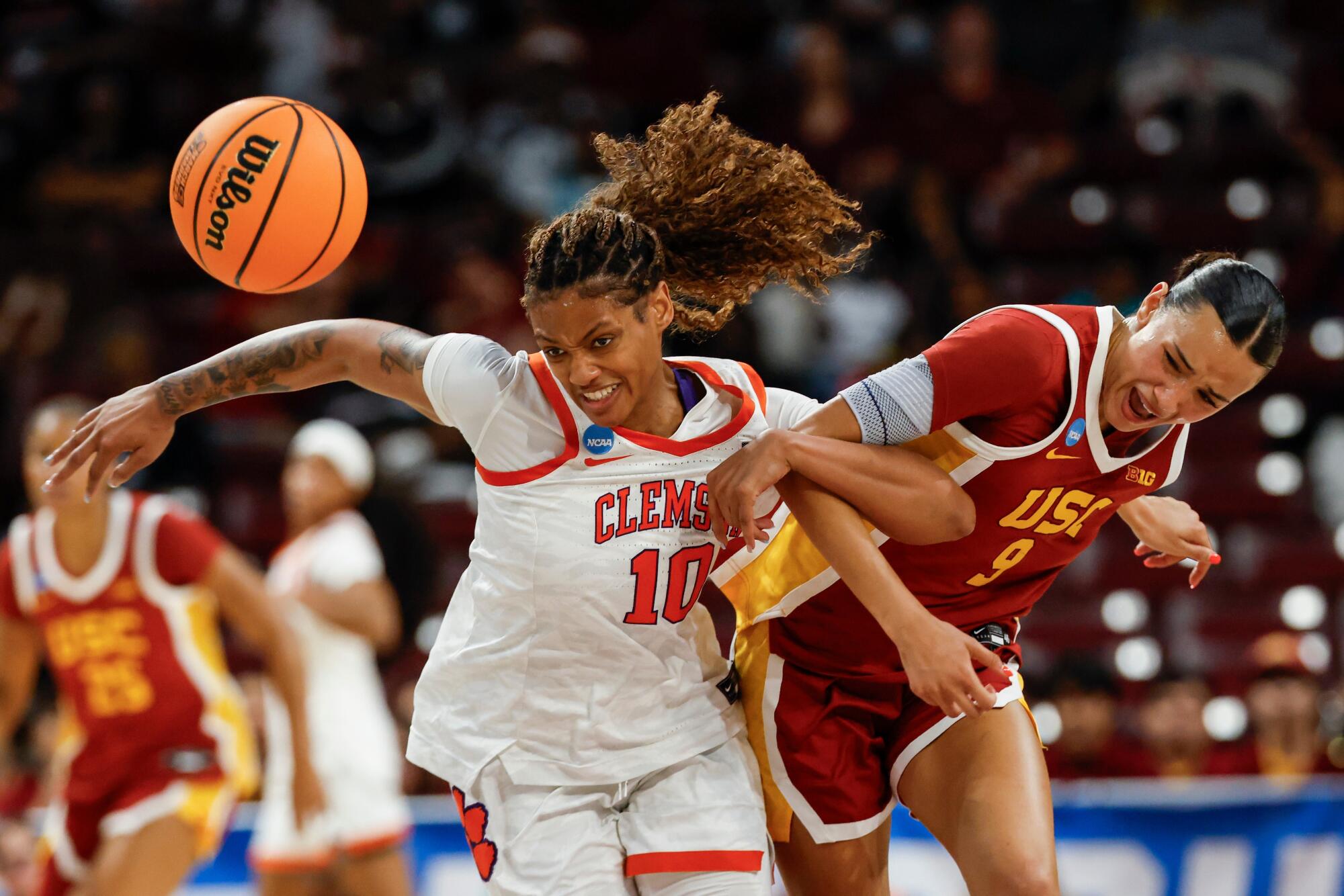 USC guard Jazzy Davidson, right, battles Clemson guard Taylor Johnson-Matthews for a loose ball.