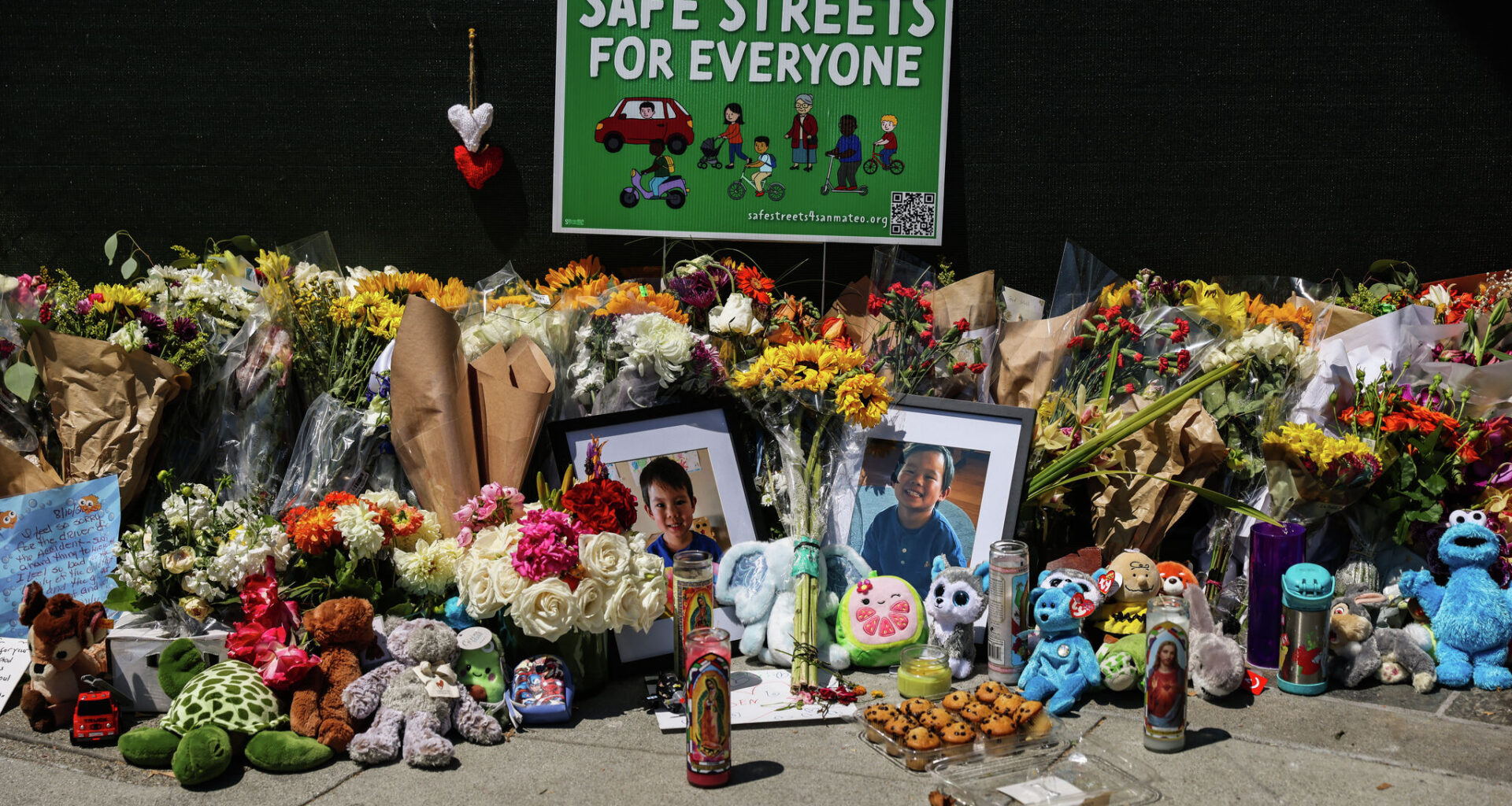A memorial is seen outside a restaurant in Burlingame where a 4-year-old boy, Ayden Fang, was killed. Fang’s parents have sued the 19-year-old driver who struck Ayden, as well as an 11-year-old e-bike rider who allegedly triggered the chain reaction crash.