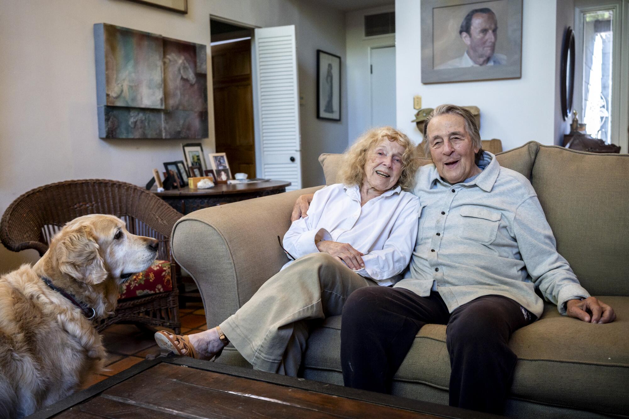 Mary Ann and Paul Cummins with their dog, Charley, at their Santa Monica home.