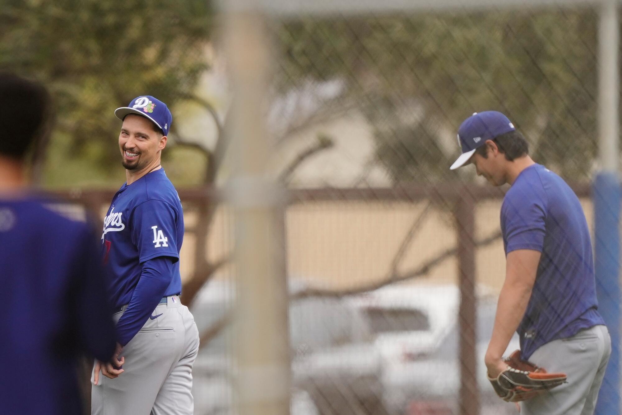 Dodgers pitcher Blake Snell, left, works out during spring training last month. Shohei Ohtani is at right.