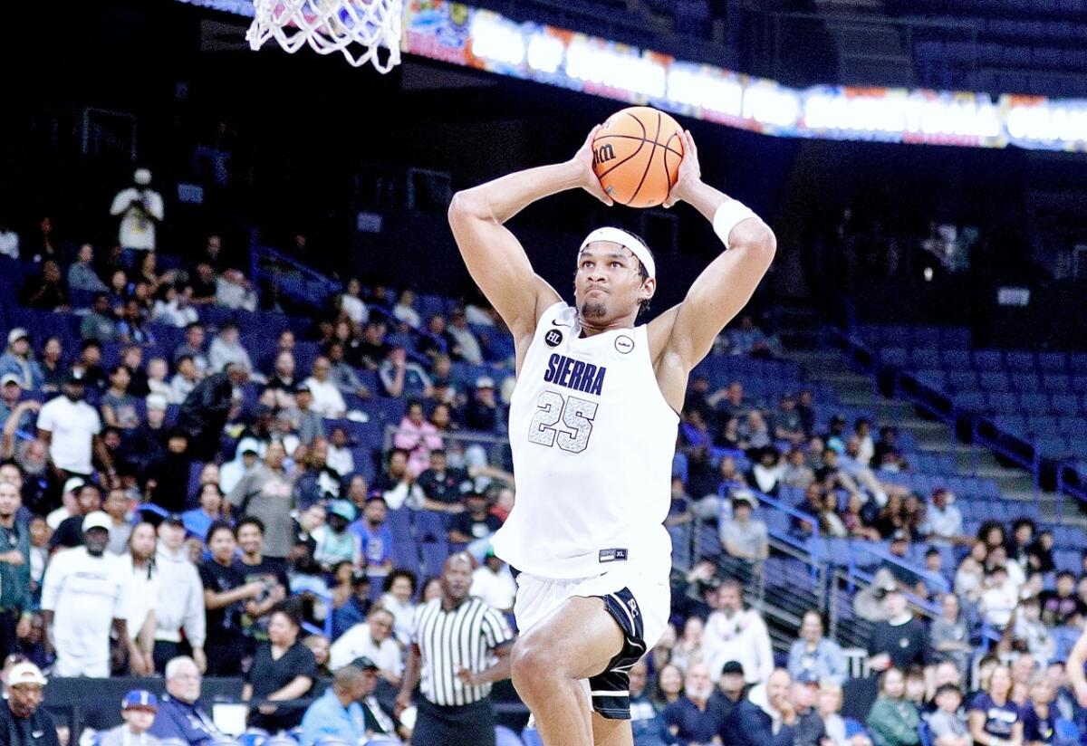 Maxi Adams of Sierra Canyon rises to deliver a dunk against Harvard-Westlake in Open Division championship game.