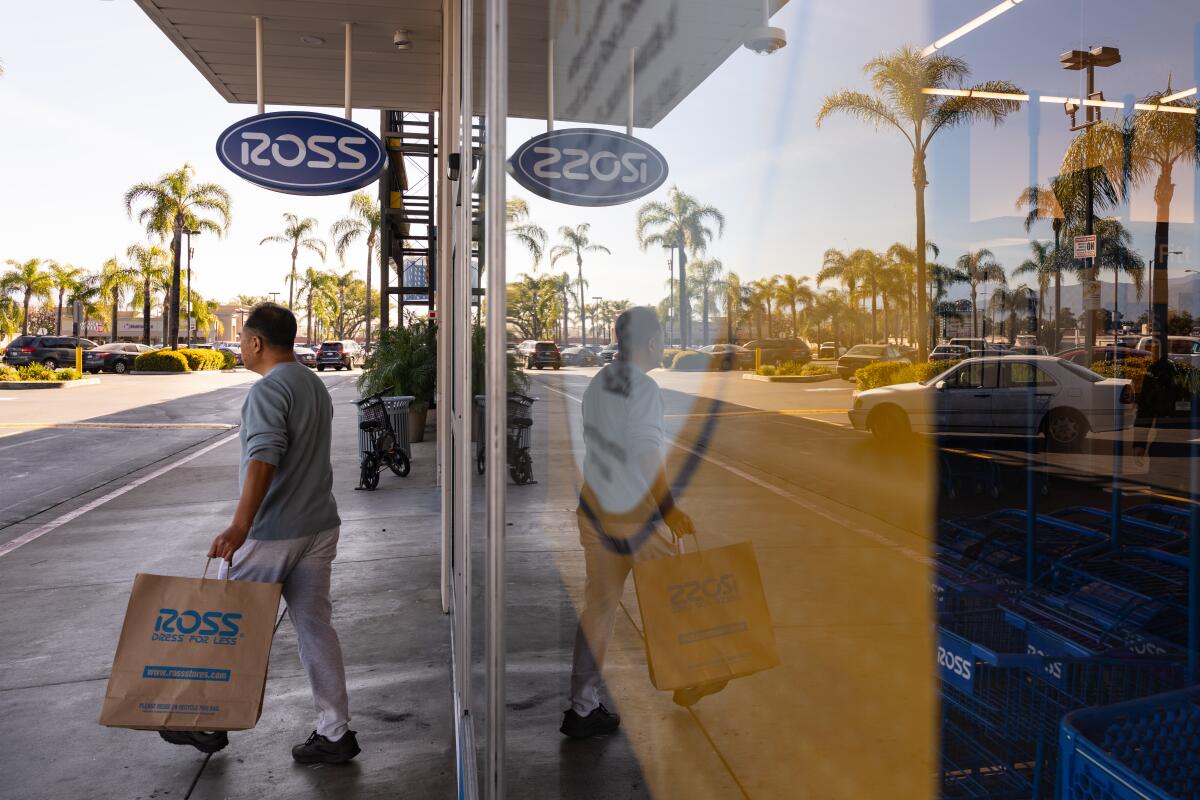 A man exits after shopping at a newly opened Ross store.