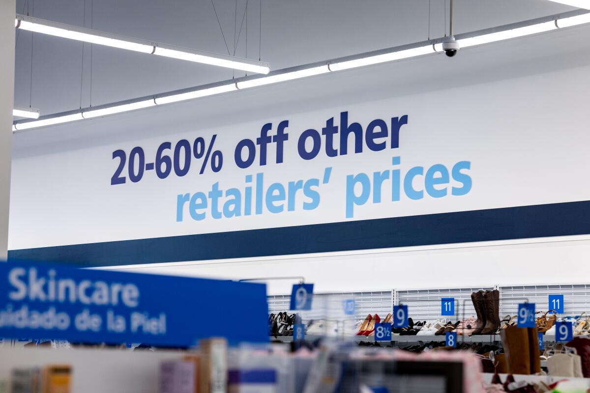 Savings signs can be found on the walls at a newly opened Ross store in Alhambra.