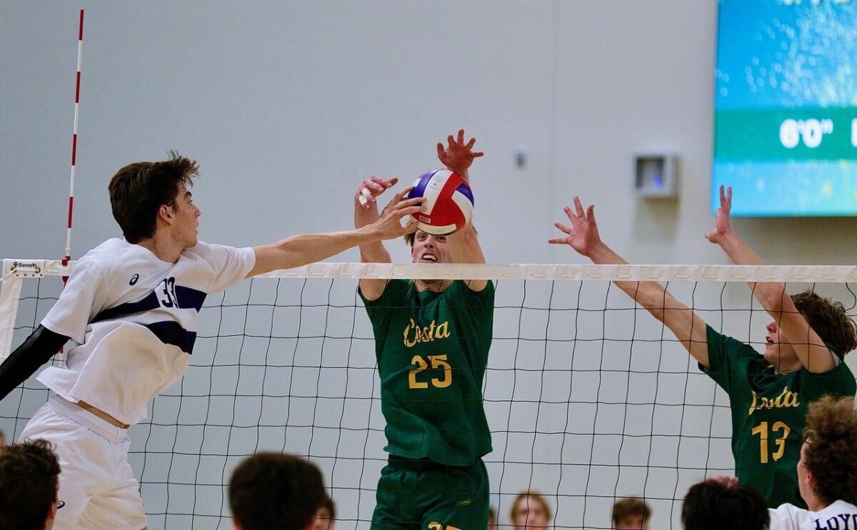 Loyola's JP Wardy, left, tries to tip the ball past Mira Costa's Colby Graham, center, and Miles Crotty.