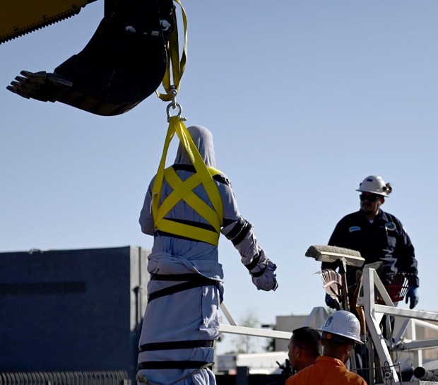 City of San Fernando crews dismantle and remove a statue of Cesar E. Chavez on March 19, 2025, after a city council voted for the removal. (Photo by Julianna Lozada)