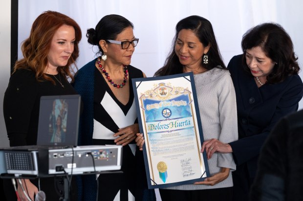 L to R; Lindsey Horvath, LA County Supervisor, Juanita Chavez, Marlina Chavez, and Hilda Solis, LA County Supervisor with the John Anson Ford Human Relations Courage award for their mother, Dolores Huerta. Juanita and Marlina accepted the award for their mother, Dolores Huerta at the Los Angeles County Hall of Administration on Tuesday, Jan. 16, 2023. (Photo by David Crane, Los Angeles Daily News/SCNG)