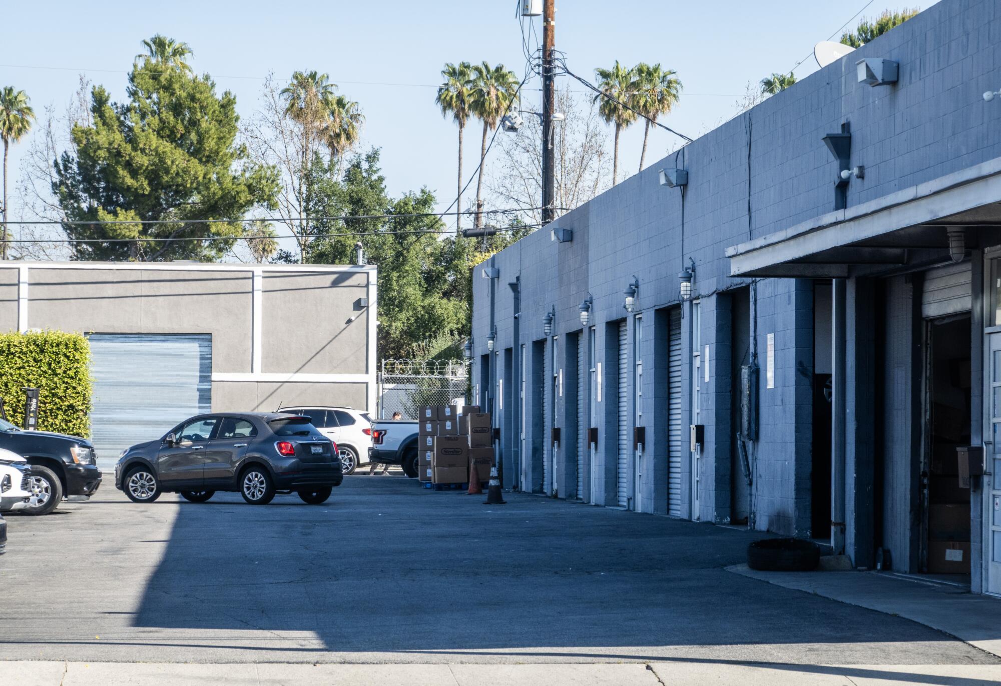 A low, long building with a series of doors.