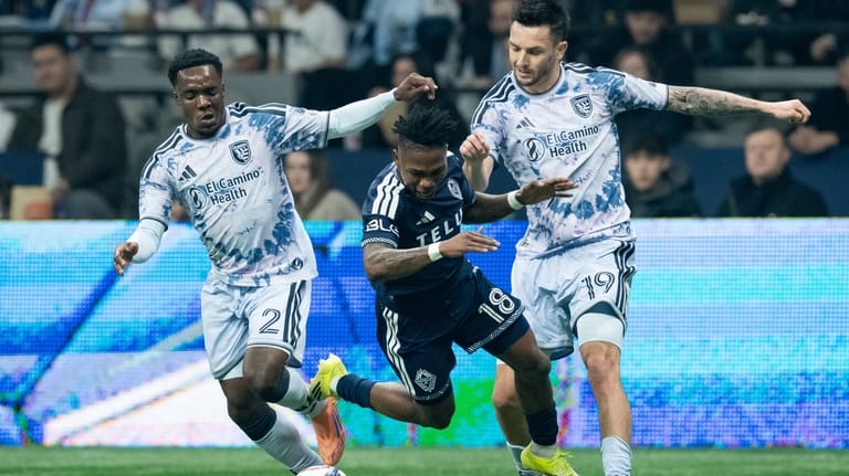 San Jose Earthquakes' Jamar Ricketts (2) and Preston Judd (19)...