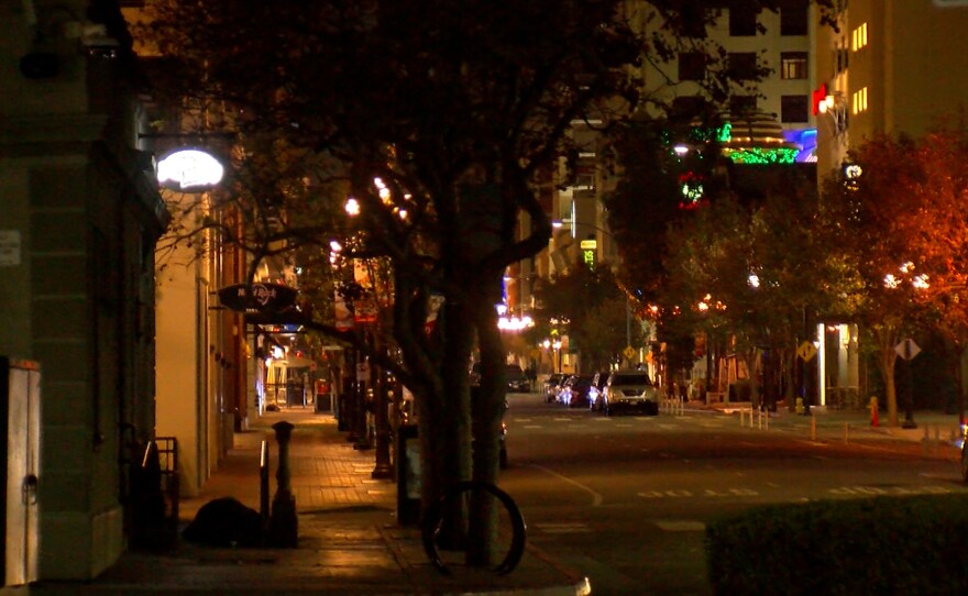 A person laying on the sidewalk is shown in an image taken during the point in time count on January 29, 2025 in downtown San Diego.
