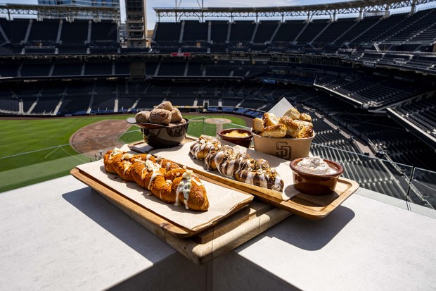 An assort of food items from Padres Pretzels, a new dining concept being introduced at Petco Park next week for the San Diego Padres' 2026 season. (Armond Feffer / San Diego Padres)