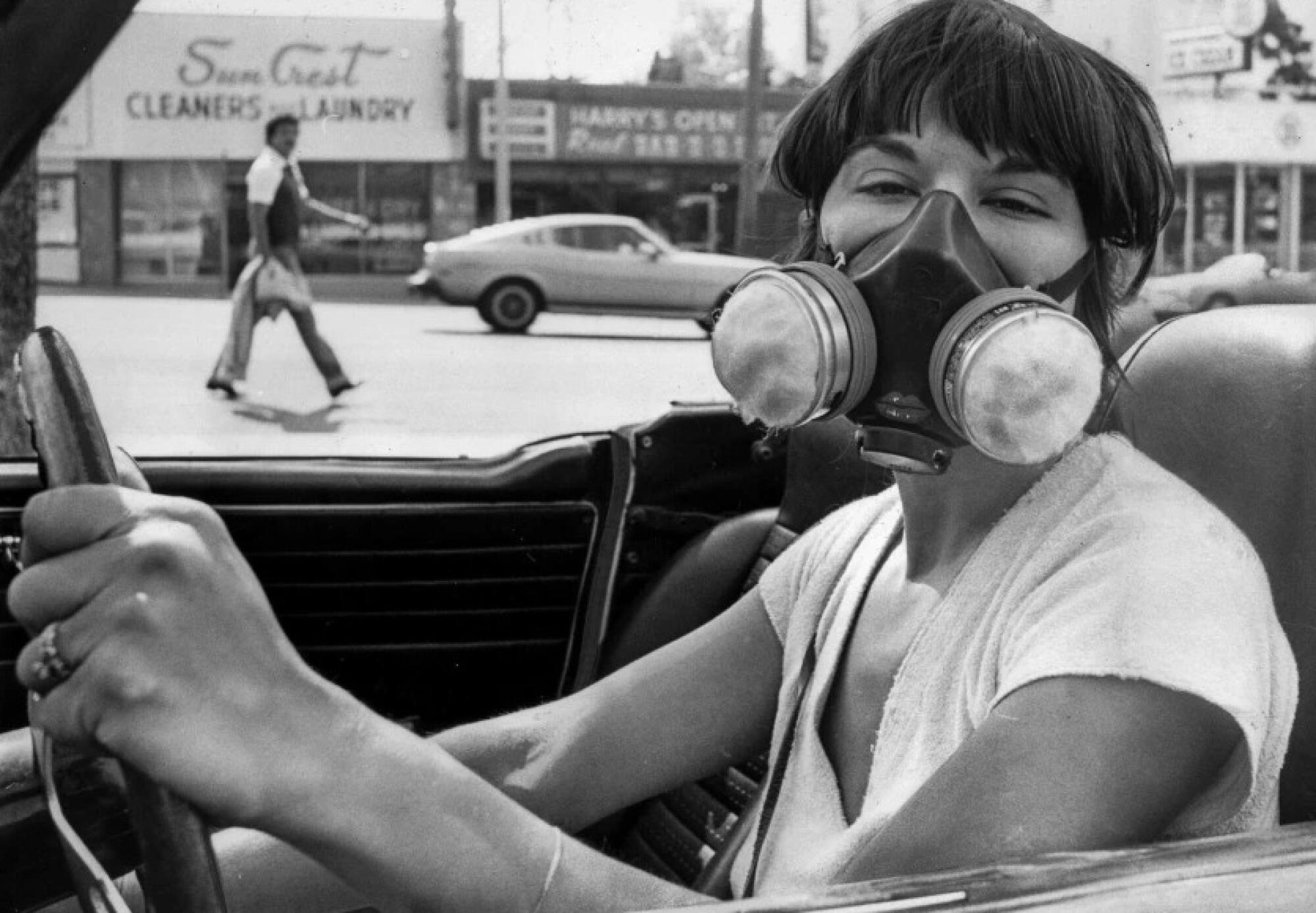 Seraphine Segal wears a mask designed to filter out airborne particles during a Los Angeles smog alert on June 29, 1979.