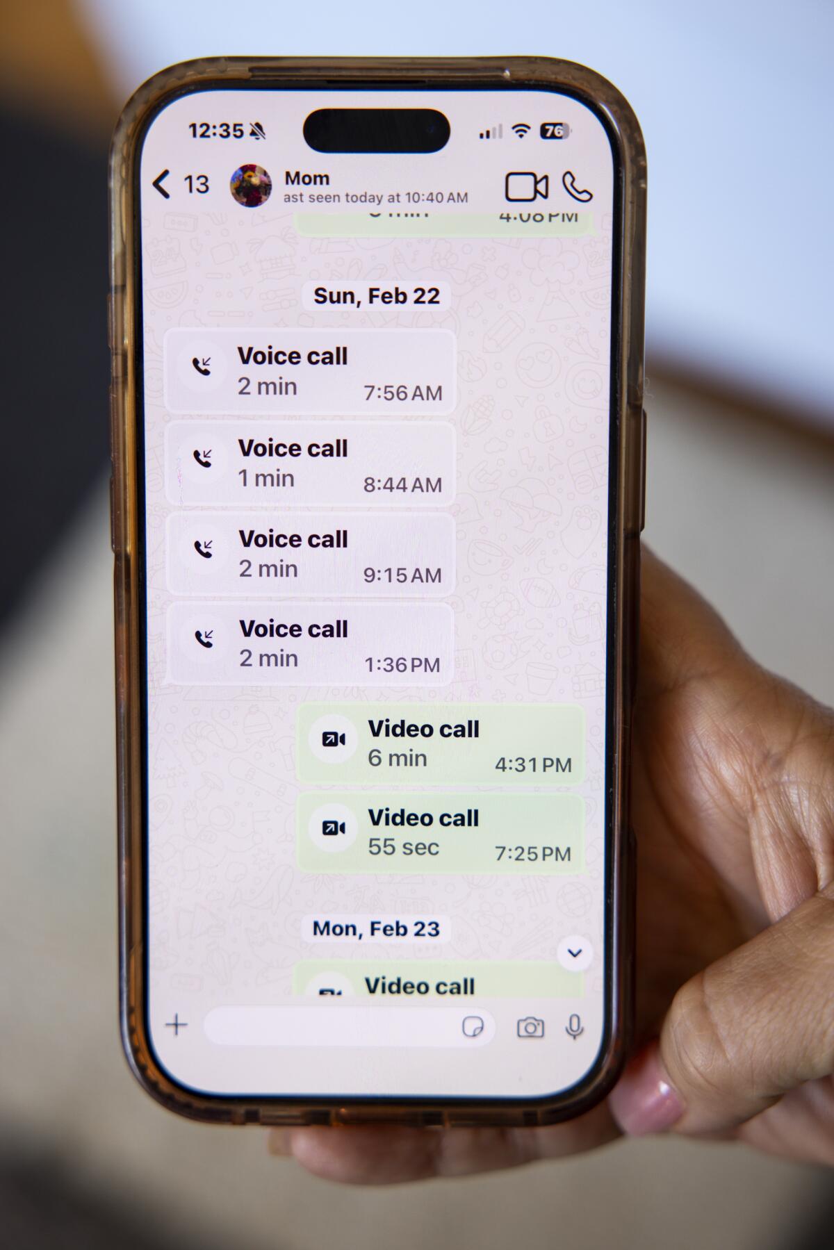 A phone's screen shows calls.
