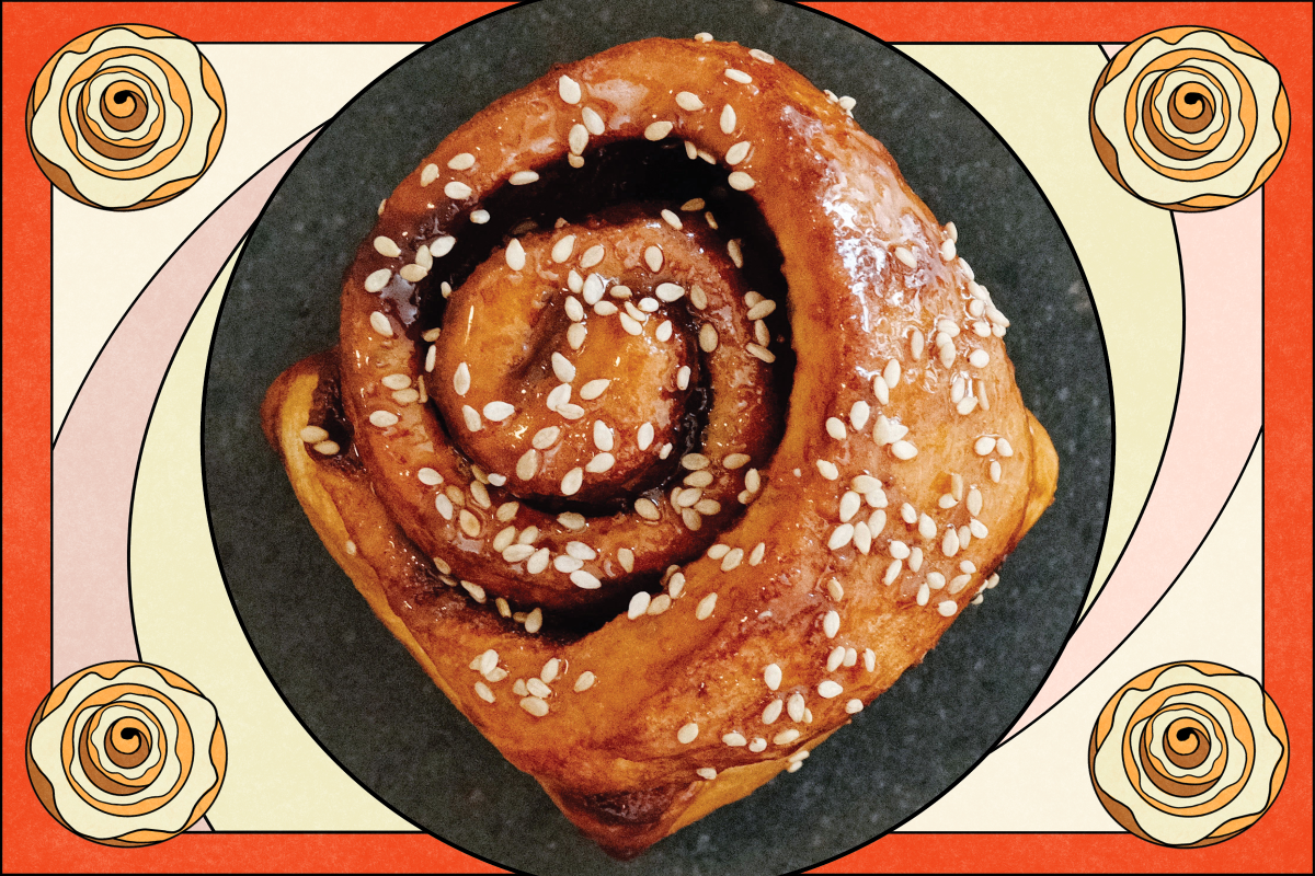 A photo of a cinnamon roll with a decorative border