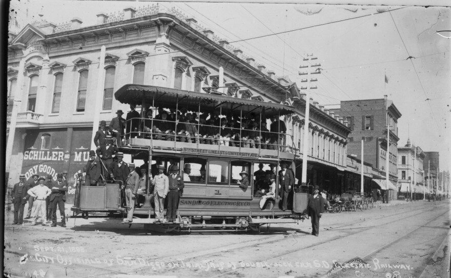 Passengers stand and sit on a double decker San Diego Electric Railway Company streetcar, Sept. 21, 1892.