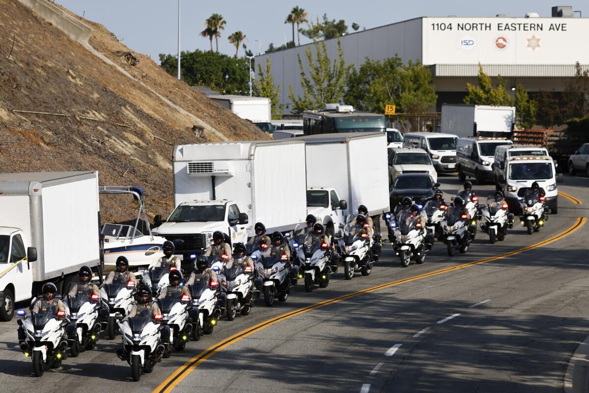 A procession leaves Biscailuz Training Center 