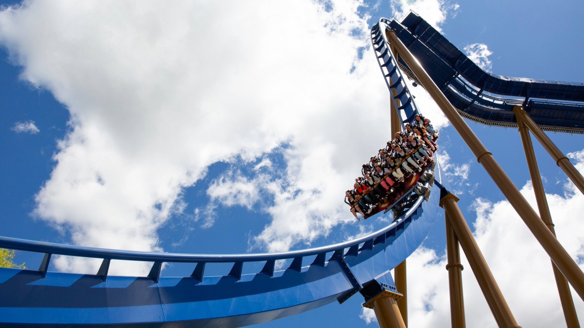 Riders on the Wrath of Rakshasa roller coaster at Six...