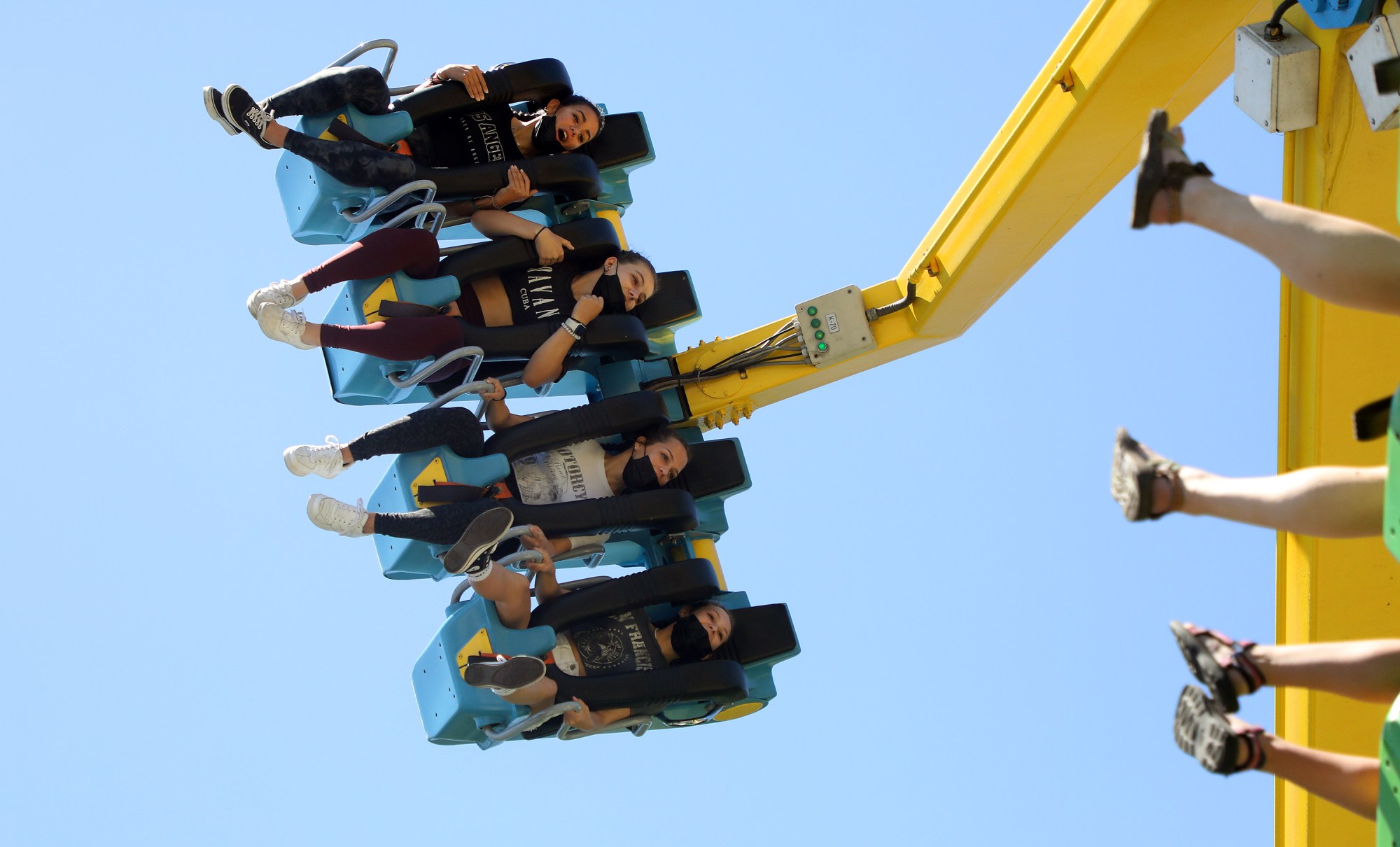 Guests ride the Delirium attraction at California’s Great America amusement...