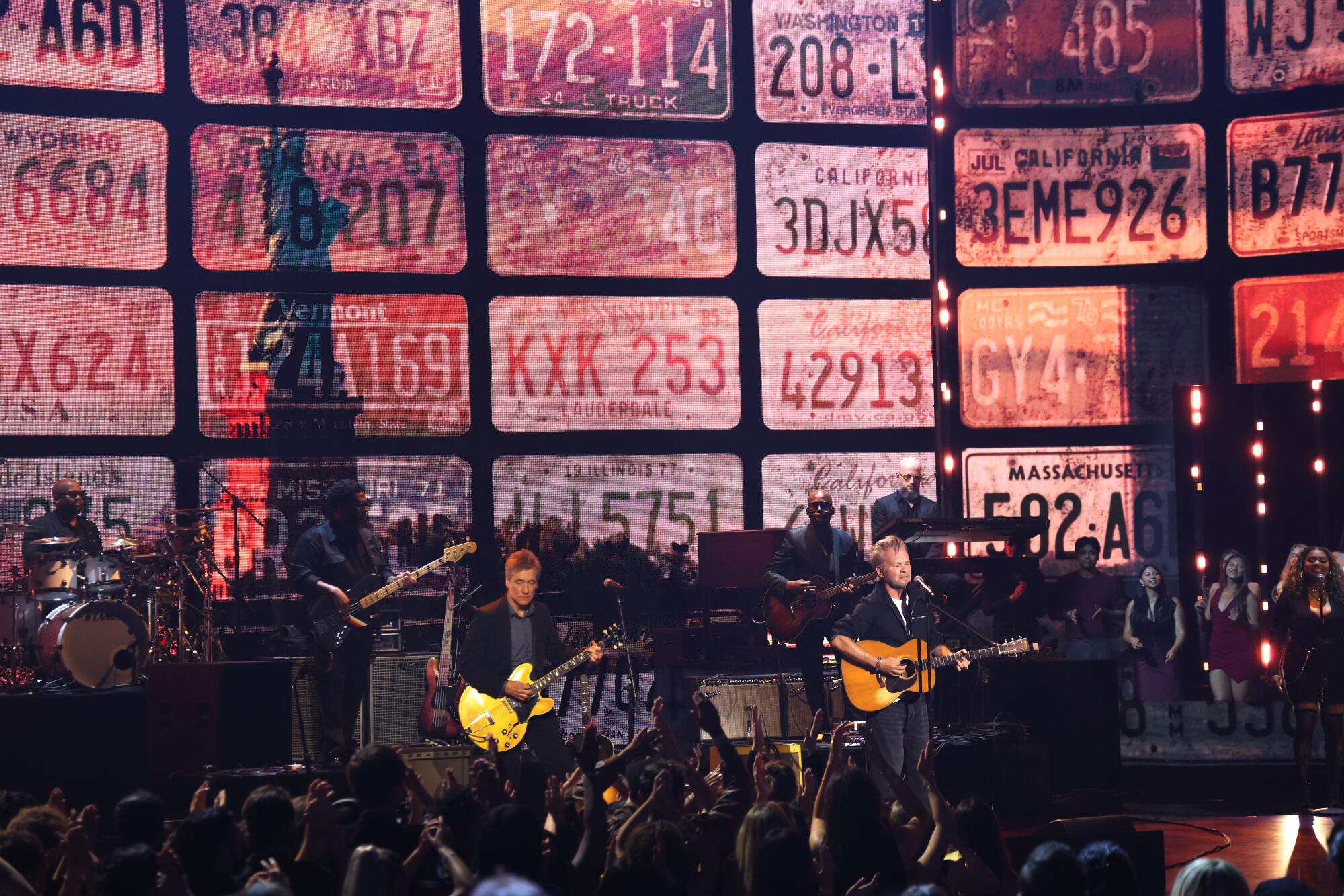 John Mellencamp, right, performs onstage at the 2026 iHeartRadio Music Awards at Dolby Theatre in Hollywood.