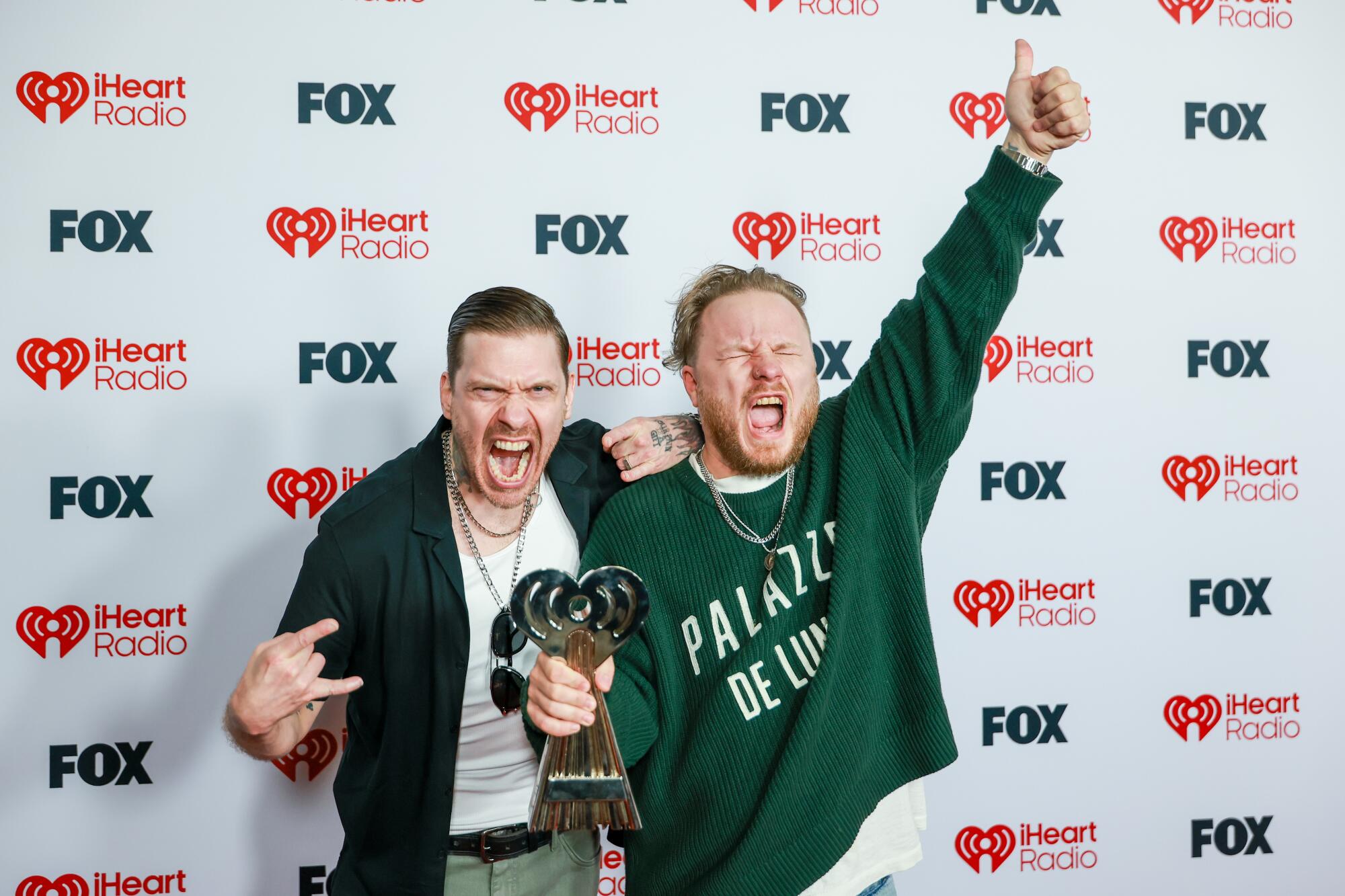 Brent Smith and Zach Myers of Shinedown on the red carpet at the Dolby Theatre for the 2026 iHeartRadio Music Awards.