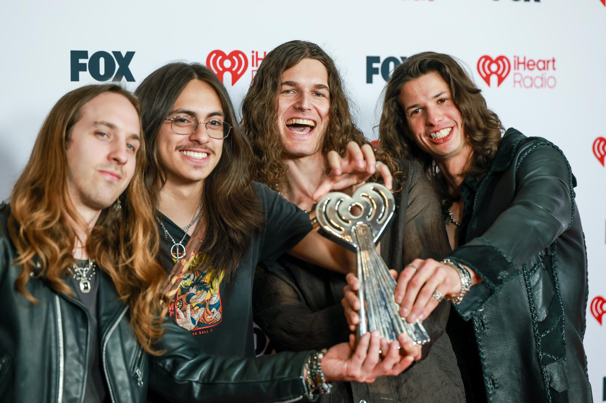 Return to Dust on the red carpet for the iHeartRadio Music Awards at the Dolby Theatre in Hollywood.