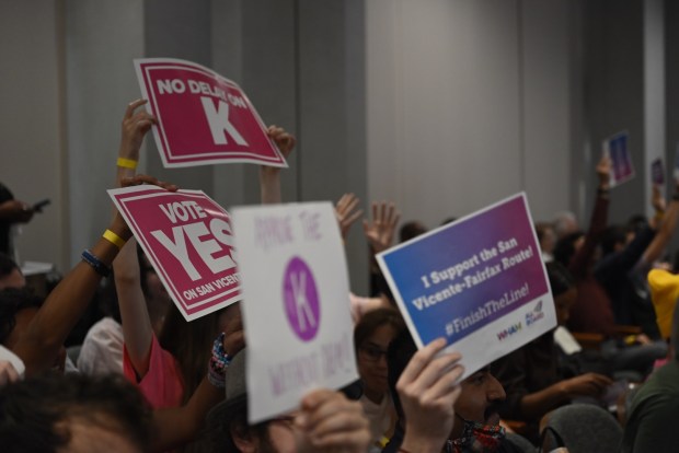 Metro's Board of Directors unanimously approved a route for the northern extension of the K Line light rail project on Thursday, March 26, advancing the 9.7-mile San Vicente-Fairfax alignment and pledging to address concerns from Mid-City residents without delaying the project. In the audience, man supporters made their voices heard. (Photo by Julianna Lozada)