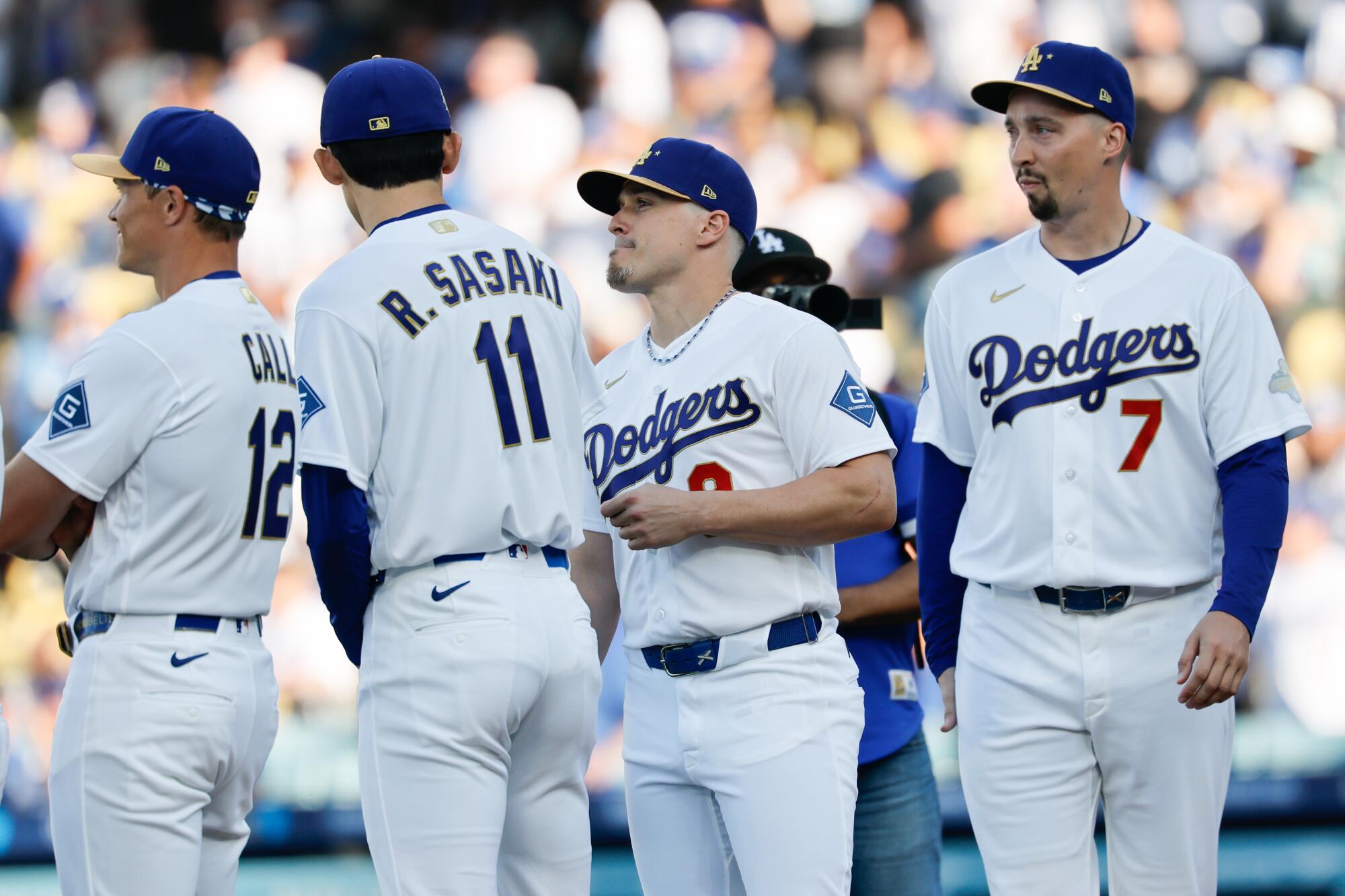 Dodgers Blake Snell, Kiké Hernandez, Roki Sasaki and Alex Call during player introductions before the game.