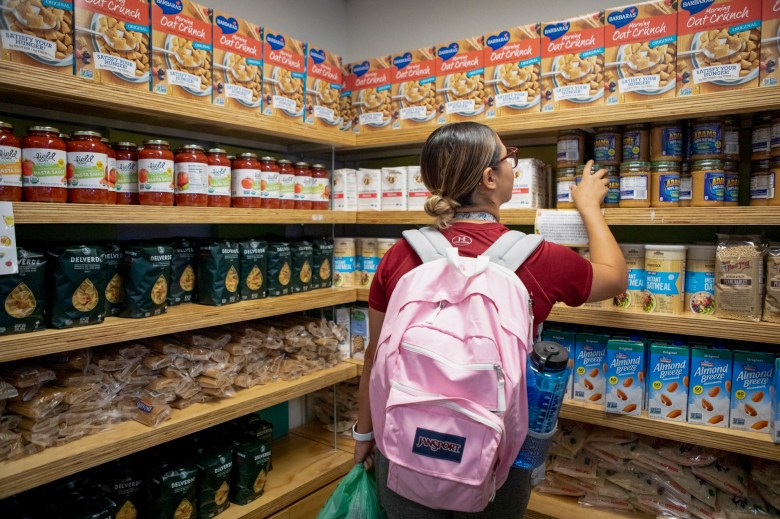 Junior Dominique Martinez shops for pantry staples at the UC Berkeley campus food pantry on Oct. 25, 2019. Photo by Anne Wernikoff for CalMatters
