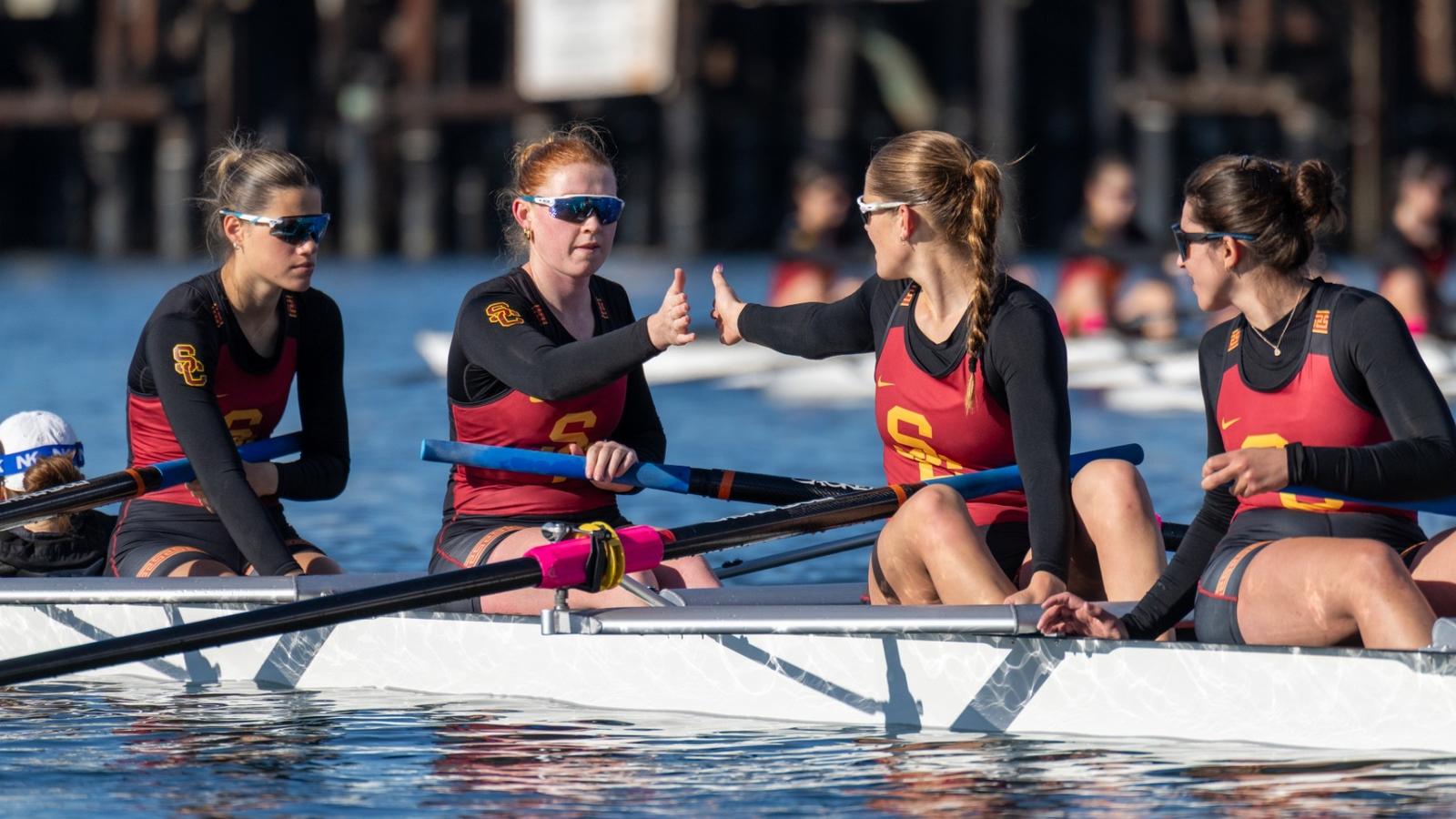 The USC Women's Rowing team poses with the trophy after beating UCLA