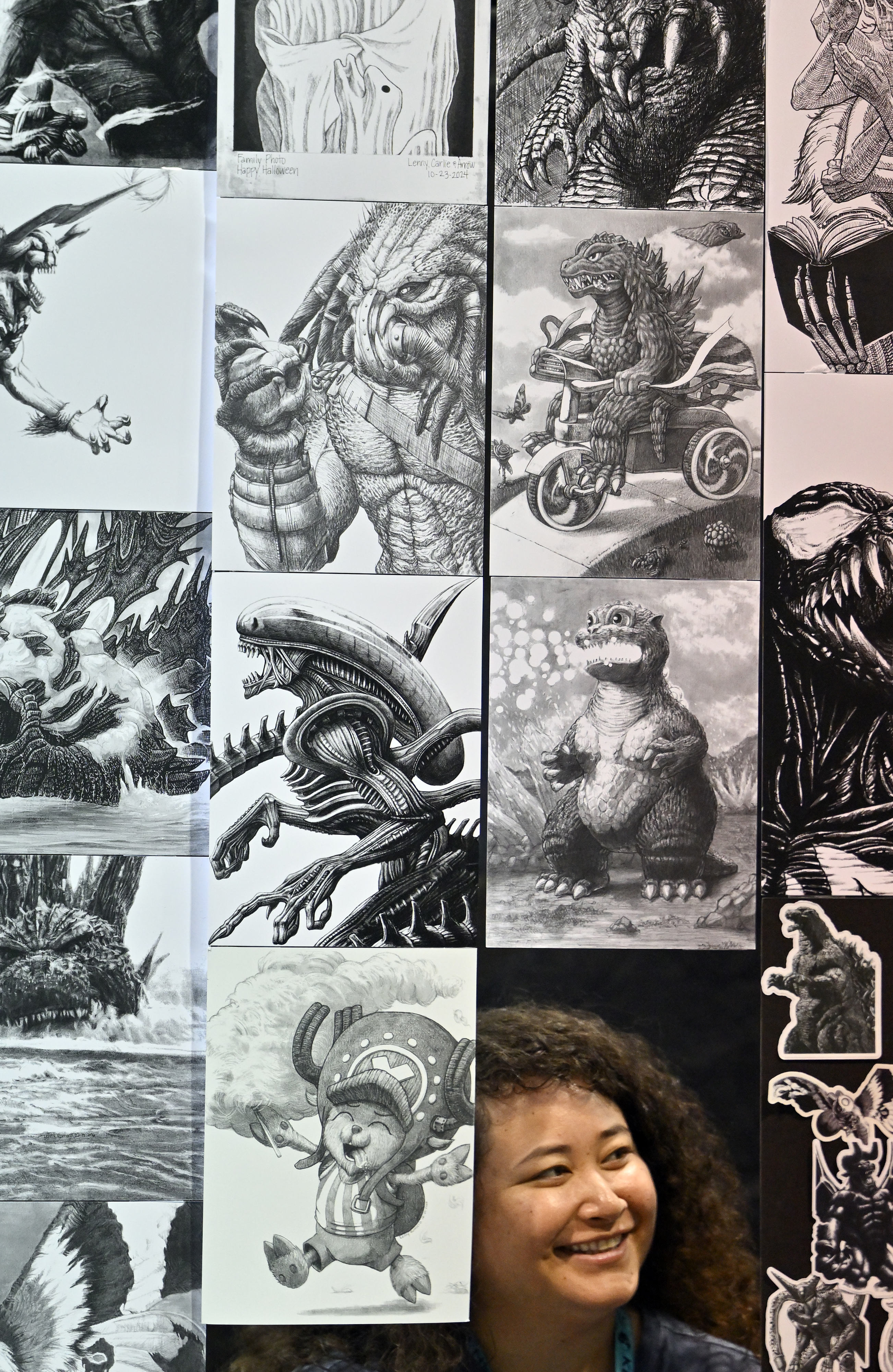 Carlie Belmodis sits among her husbandâs artmwork and the Lenzations...