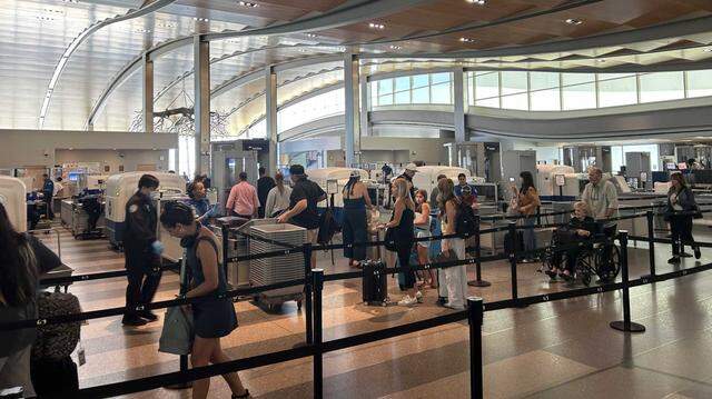 Congress remains at odds over DHS funding, but President Trump on Friday ordered TSA officers to be paid. The agency’s shutdown has affected air travelers all over the country. This photo shows travelers passing through the Terminal B security checkpoint at Sacramento International Airport in July 2025. 