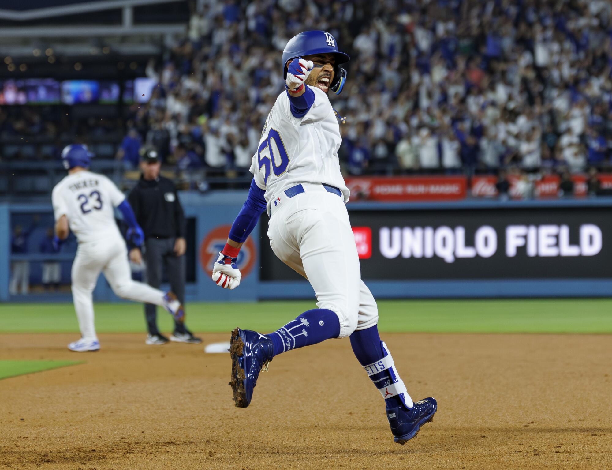 Dodgers shortstop Mookie Betts celebrates after hitting a three-run homer against Arizona Diamondbacks in the third inning.