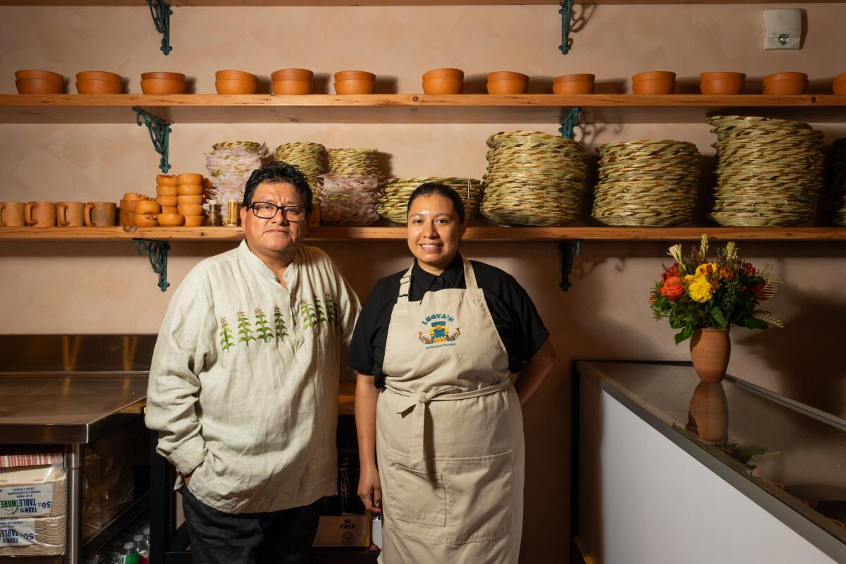  Alfonso "Poncho" Martinez and Evelyn Gregorio of Lugya'h stand for a portrait.