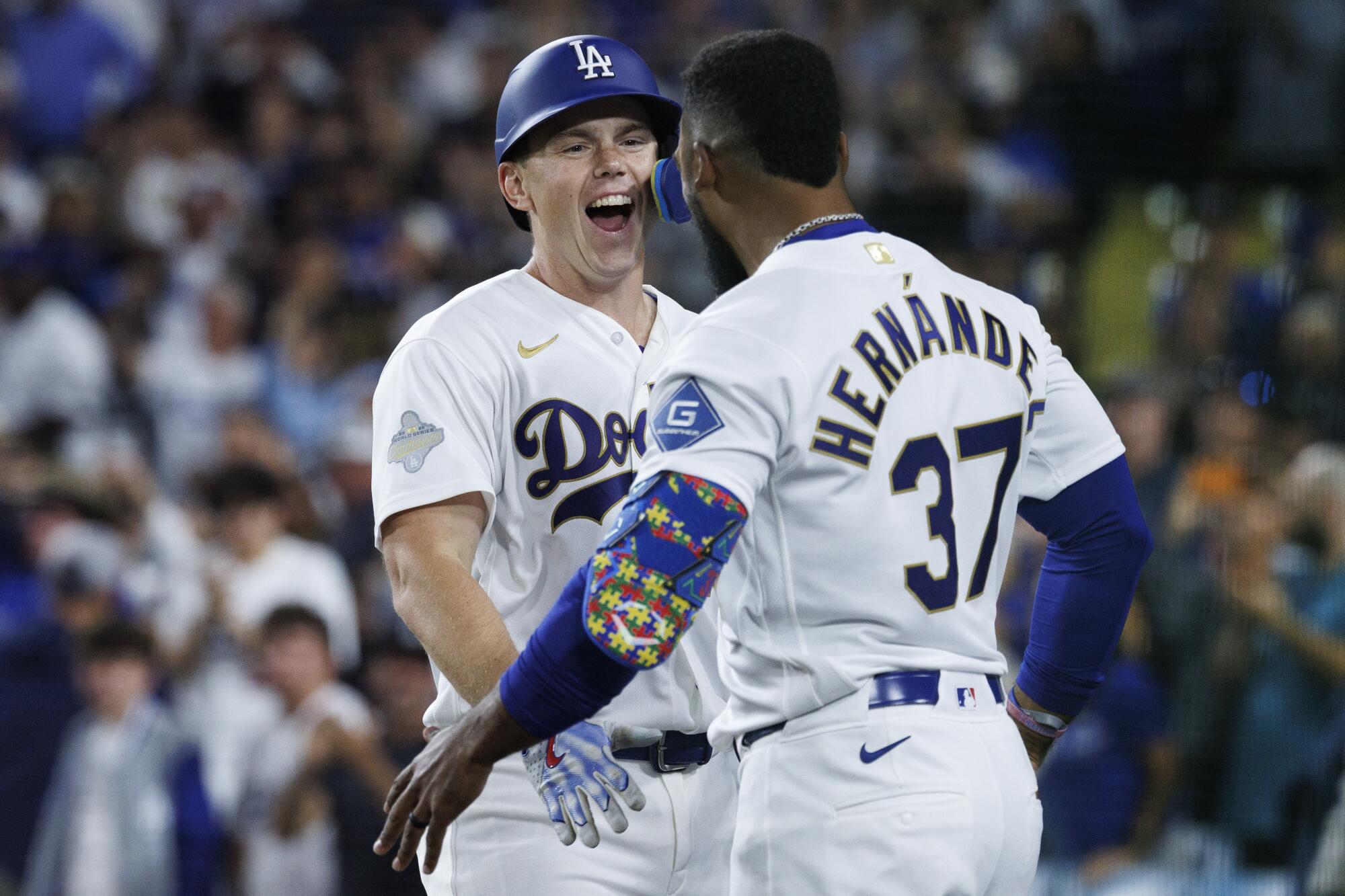 Dodgers catcher Will Smith, left, celebrates with Tesocar Hernández after hitting a two-run home run.
