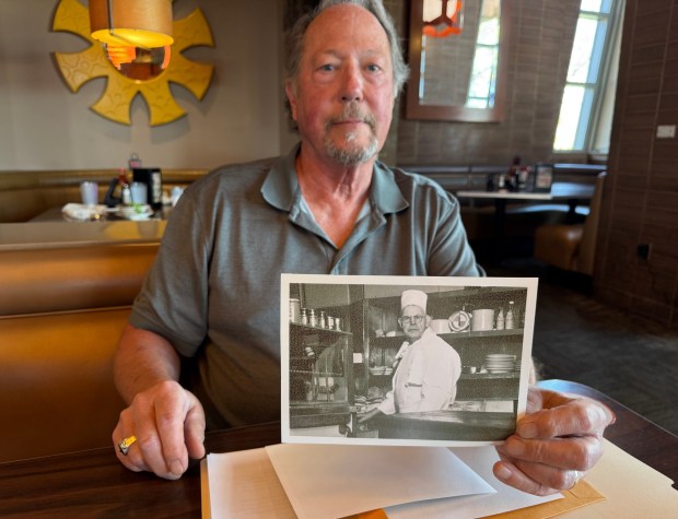 Tim Peron of Pomona holds a photo of Jack Garlinghouse, his great-grandfather, the man who may have invented the French dip sandwich. (Photo by David Allen, Inland Valley Daily Bulletin/SCNG)