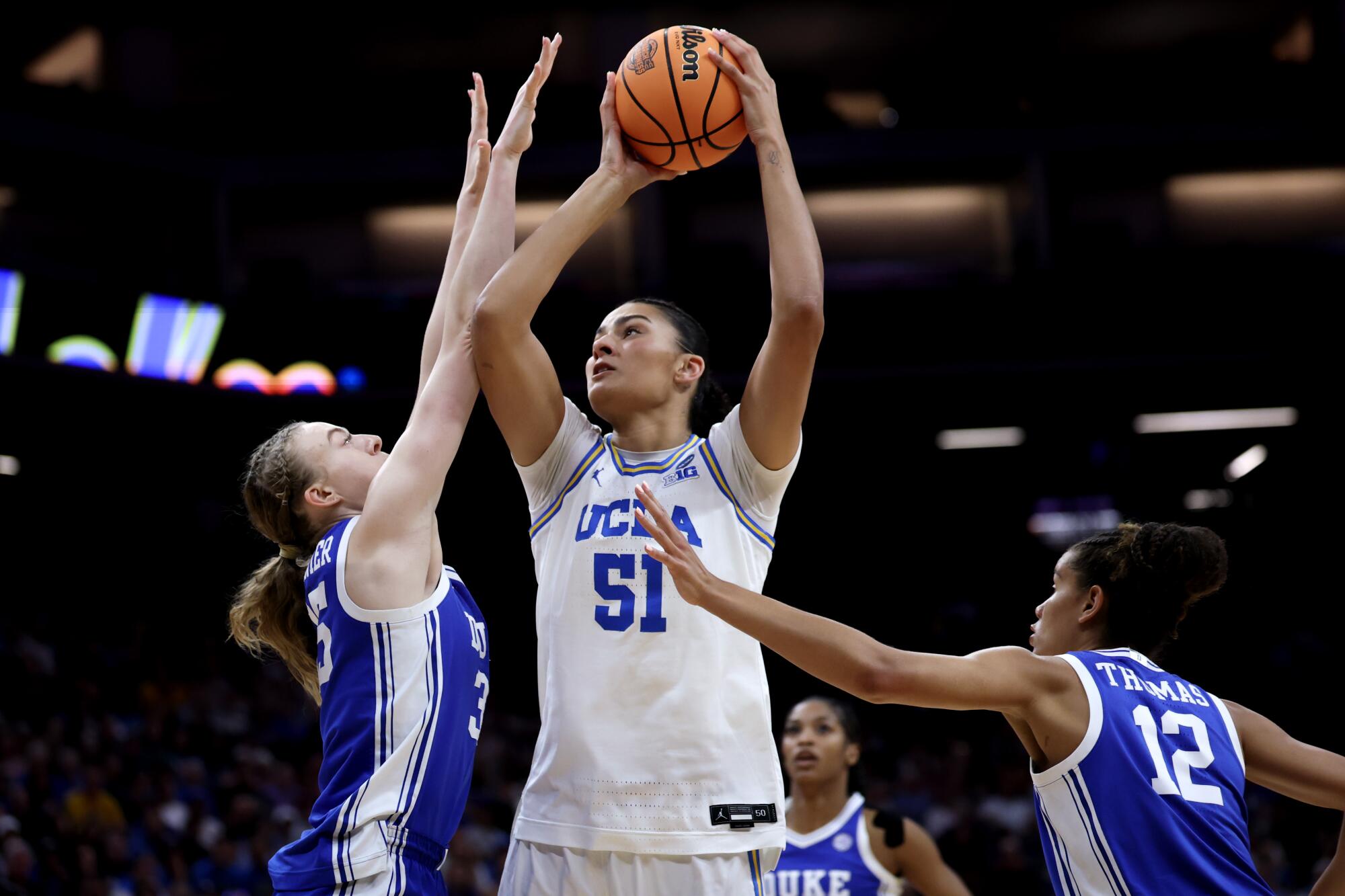 UCLA center Lauren Betts drives to the basket over Duke forward Toby Fournier in the first half of the Bruins' win.