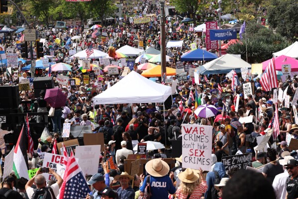 Demonstrators gather in downtown Los Angeles during a "No Kings" protest Saturday, March 28, 2026. (AP Photo/Jill Connelly)