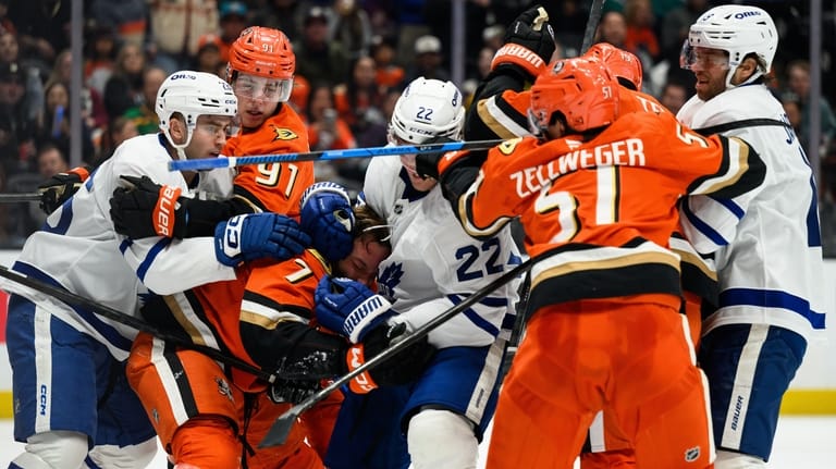 Anaheim Ducks and Toronto Maple Leafs players clash during the...