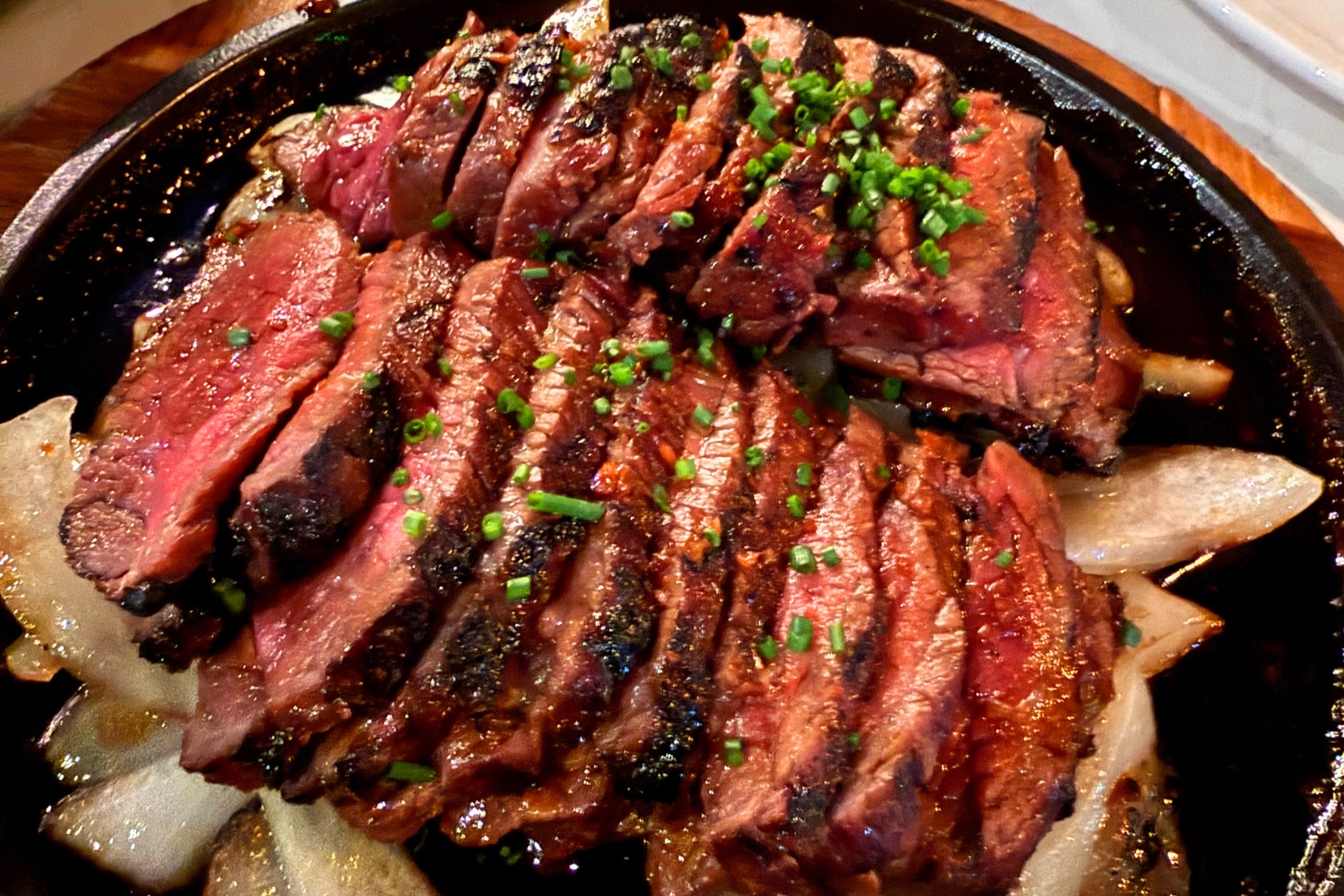 The Zabuton, charcoal-cooked wagyu steak, cooked medium rare, served with...