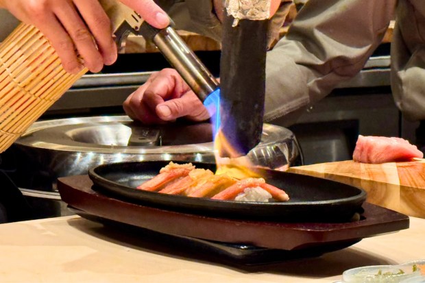 Shinohara using binchotan charcoal to flavor the nigiri. (Photo by Brock Keeling, Orange County Register/SCNG)