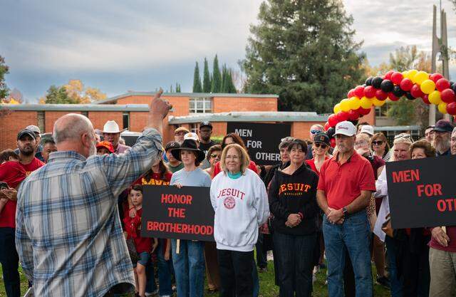 David Leatherby, a 1974 graduate and proprietor of Leatherby’s Family Creamery, speaks to a November rally against the proposal to allow girls to attend Jesuit High School in Carmichael. 